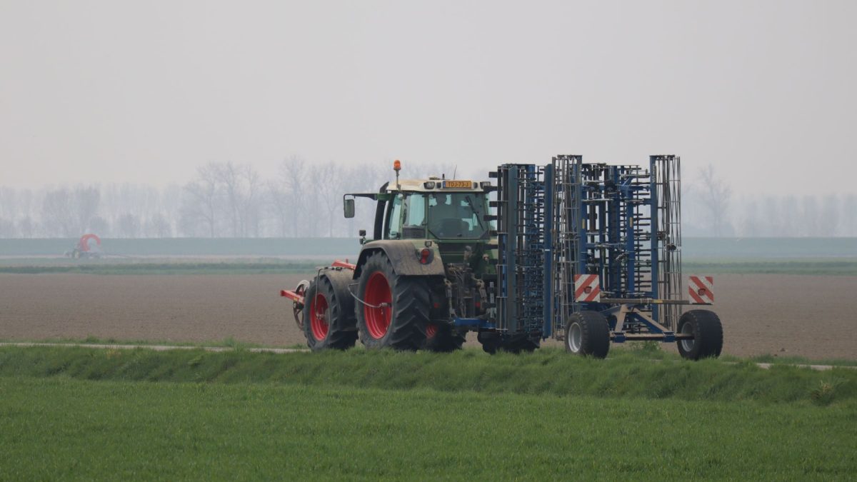 A tractor working a prepared field in Punjab, Pakistan